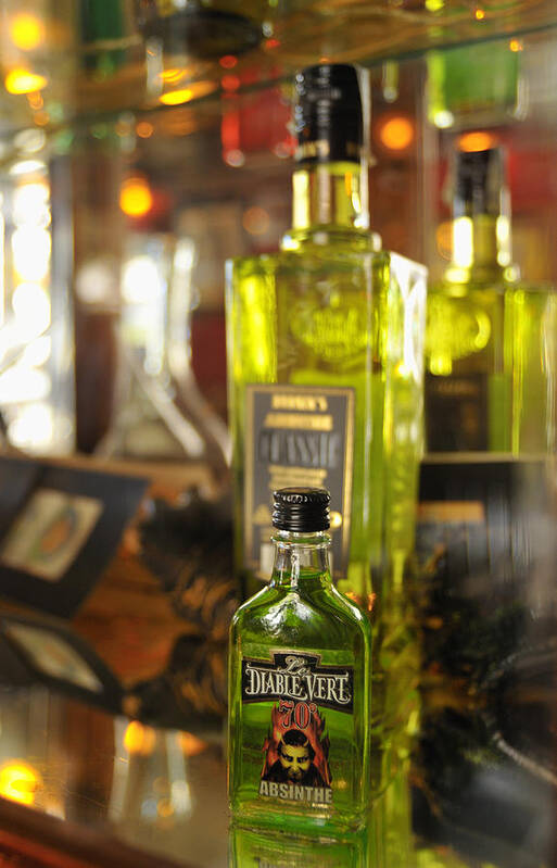 Absinthe Poster featuring the photograph Bottles with Absinthe in Bar by Matthias Hauser