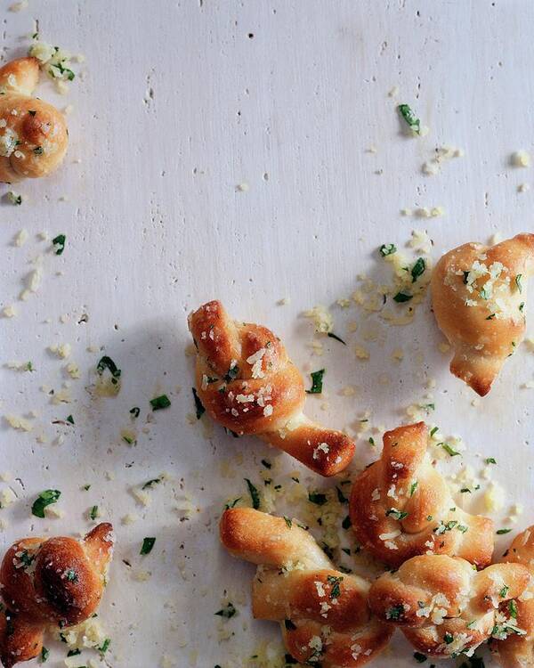 Studio Shot Poster featuring the photograph A Group Of Garlic Knots by Romulo Yanes