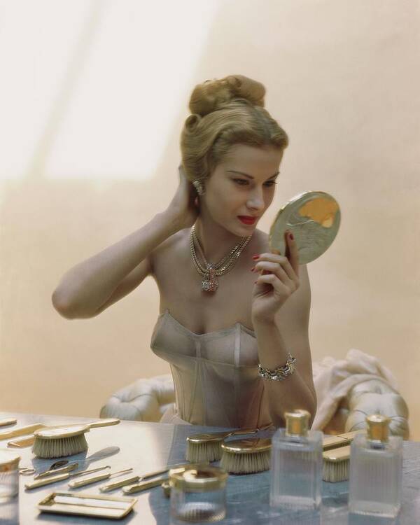 Beauty Poster featuring the photograph A Model At A Dressing Table by John Rawlings