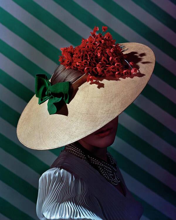 Accessories Poster featuring the photograph A Model Wearing A Straw Hat by Andre Durst