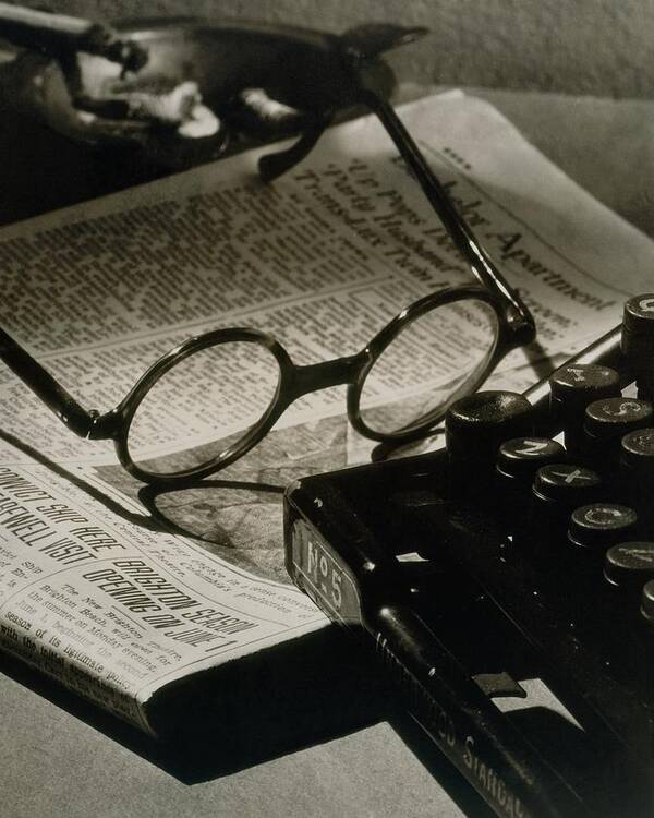 Literary Poster featuring the photograph A Pair Of Glasses On Top Of A Newspaper by Irving Browning