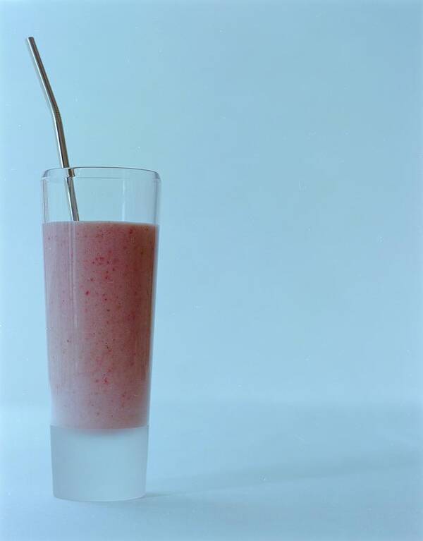 Beverage Poster featuring the photograph A Strawberry Flavored Drink by Romulo Yanes