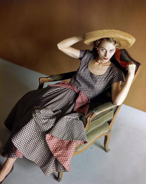 Accessories Poster featuring the photograph A Woman Wearing A Patterned Dress Sitting In An by Horst P. Horst