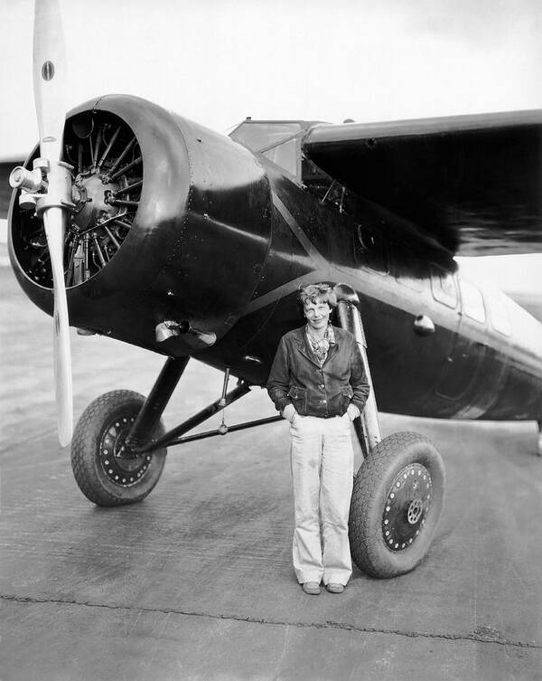 1935 Poster featuring the photograph Amelia Earhart And Her Plane by Underwood Archives