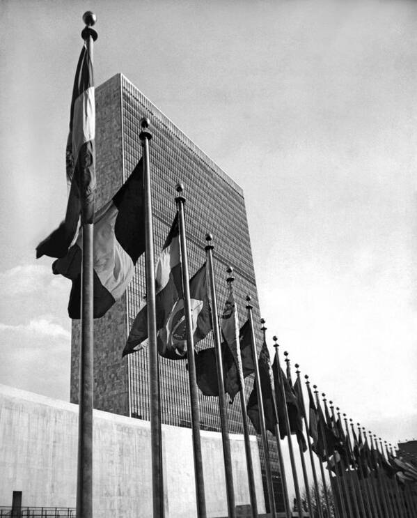 1957 Poster featuring the photograph Flags Flying At United Nations by Underwood Archives