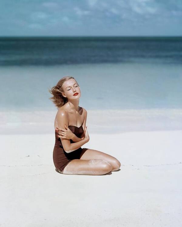 Fashion Poster featuring the photograph Liz Benn Sitting On A Beach by John Rawlings