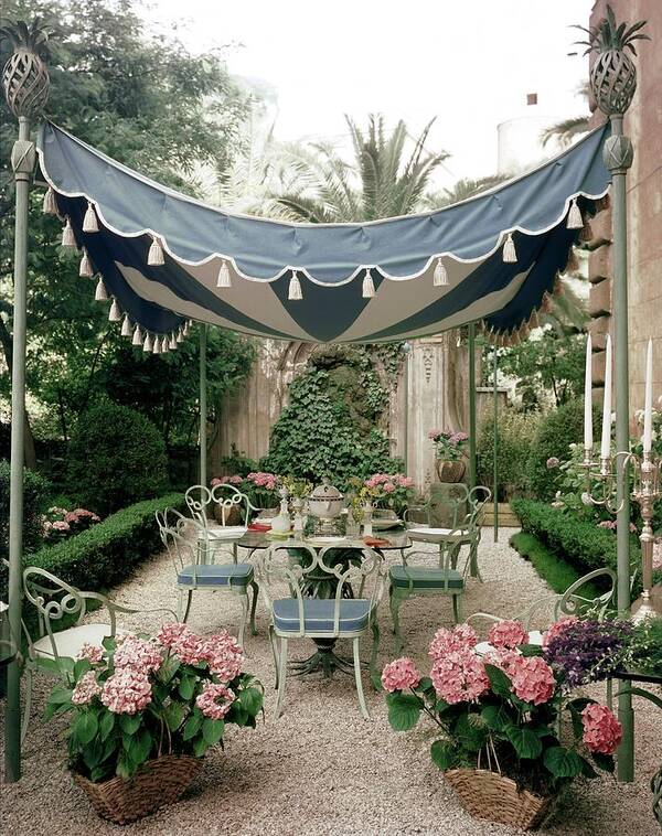 Flowers Poster featuring the photograph Outdoor Furniture On A Terrace by Tom Leonard