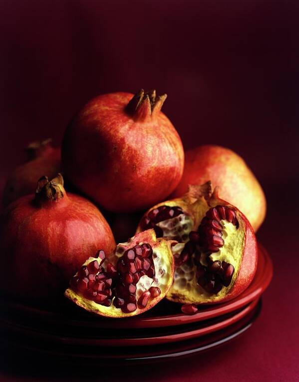Fruits Poster featuring the photograph Pomegranates by Romulo Yanes