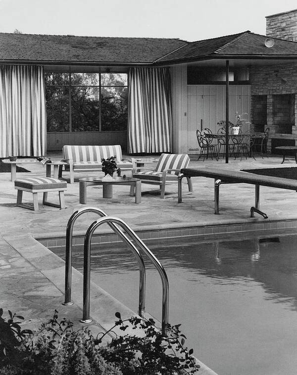 Architecture Poster featuring the photograph The Pool And Pavilion Of A House by Sharland 