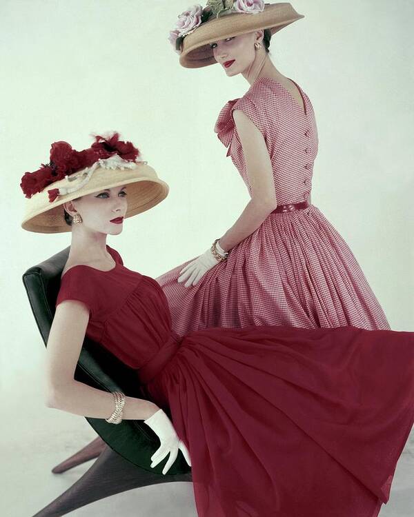Fashion Poster featuring the photograph Two Models Wearing Red Dresses by Karen Radkai