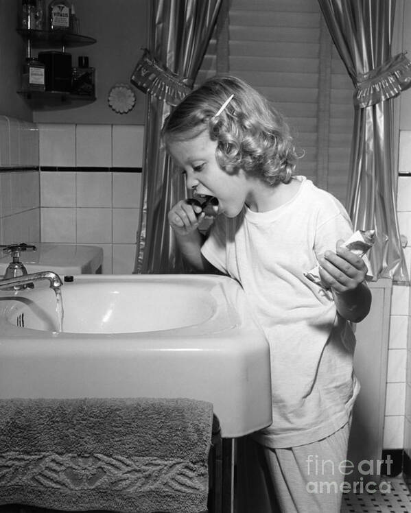 1950s Poster featuring the photograph Girl Brushing Her Teeth, C.1950s by E. Hibbs/ClassicStock