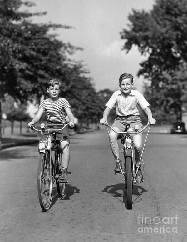 1930s Poster featuring the photograph Two Boys Riding Bikes, C.1930-40s by H Armstrong Roberts ClassicStock