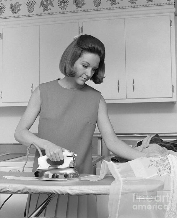 1970s Poster featuring the photograph Woman Ironing An Apron, C.1970s by H. Armstrong Roberts/ClassicStock