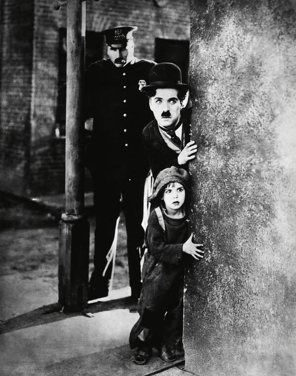 Charles Chaplin Poster featuring the photograph CHARLIE CHAPLIN and JACKIE COOGAN in THE KID -1921-. #1 by Album