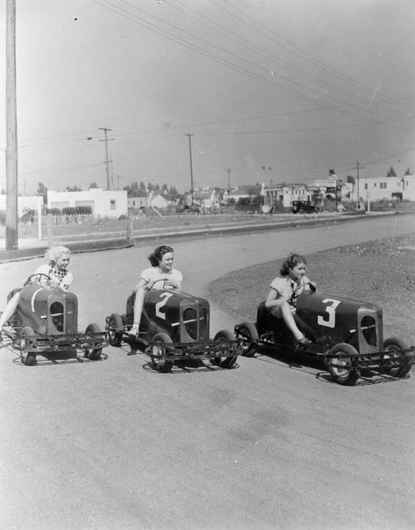 Recreational Pursuit Poster featuring the photograph Go Go Cart Girls #1 by General Photographic Agency