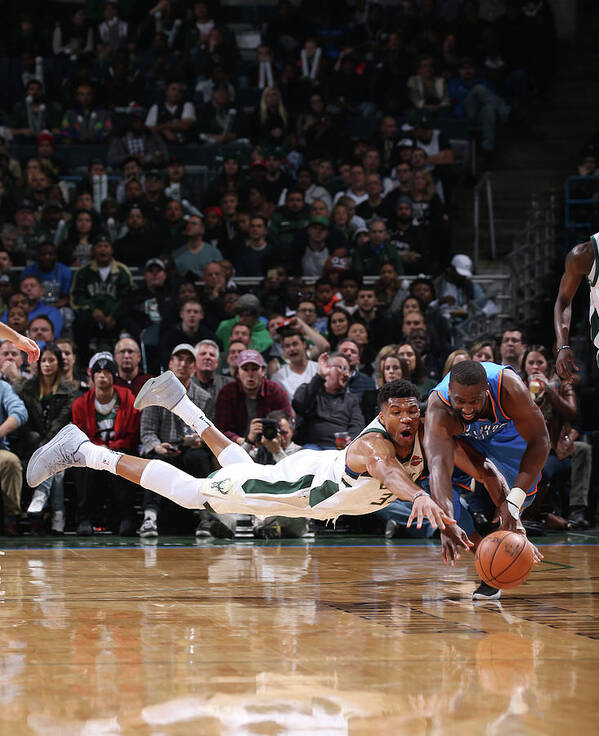 Giannis Antetokounmpo Poster featuring the photograph Raymond Felton and Giannis Antetokounmpo by Gary Dineen