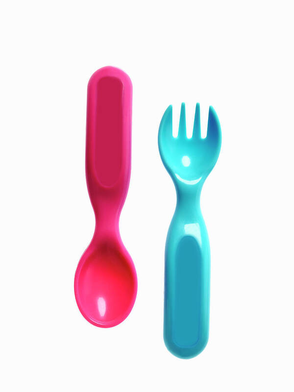Material Poster featuring the photograph A Pink Plastic Baby Spoon And A Blue by Mint Images - David Arky