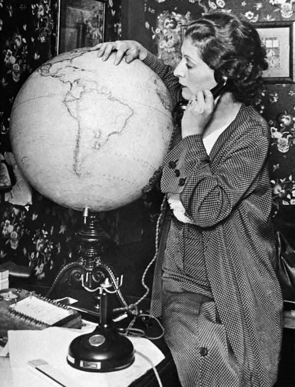 1035-1152 Poster featuring the photograph Mme. Costes With Globe by Underwood Archives