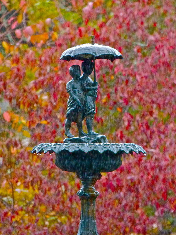 Statue Poster featuring the photograph Walking in the Rain by Jean Wright
