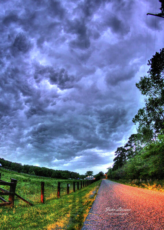 Clouds Poster featuring the photograph Storm Clouds over Main Street #1 by John Loreaux