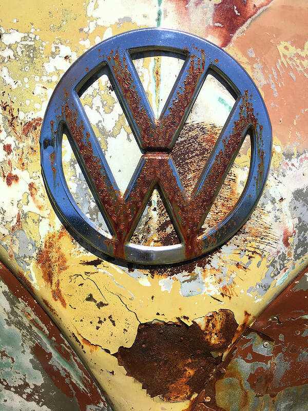Kelly Hazel Poster featuring the photograph VW Volkswagen Emblem with Rust by Kelly Hazel