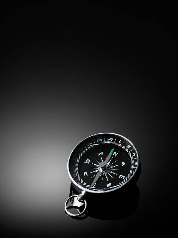 East Poster featuring the photograph Compass On A Dark Background by Wragg