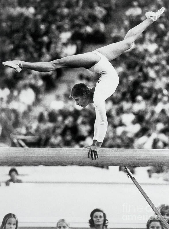 Event Poster featuring the photograph Olga Korbut Performing On Balance Beam by Bettmann
