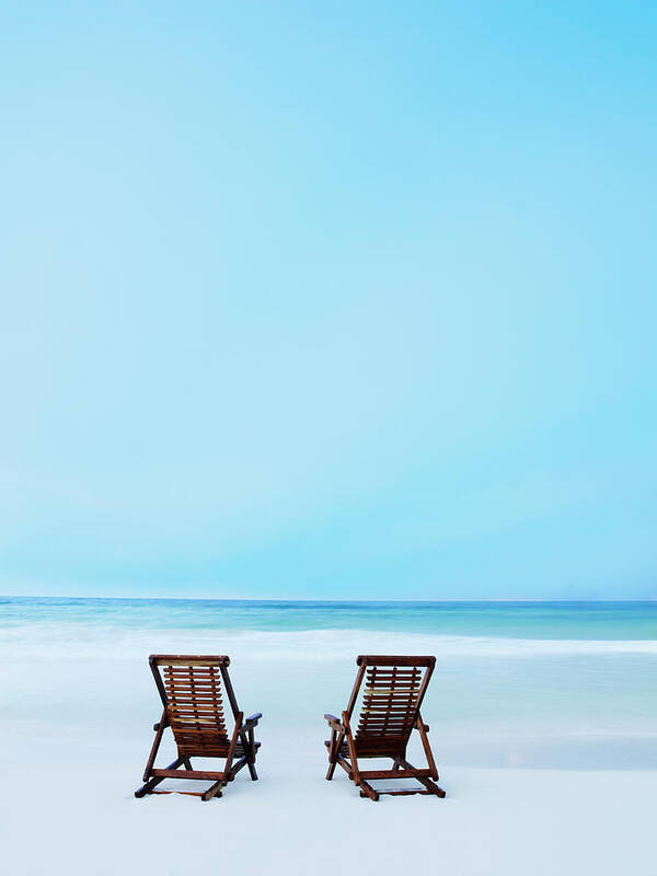 Summer Poster featuring the photograph Two Beach Chairs On Tropical Beach At by Thomas Barwick