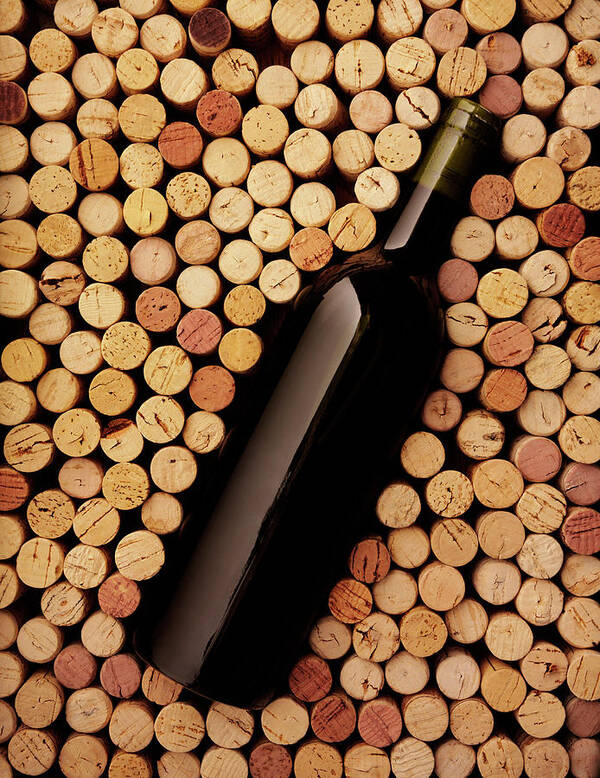 Alcohol Poster featuring the photograph Wine Bottle And Corks by Wragg