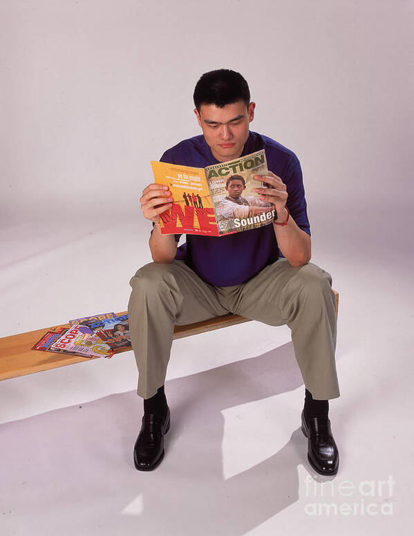 Nba Pro Basketball Poster featuring the photograph Yao Ming Reads Magazine by Andrew D. Bernstein