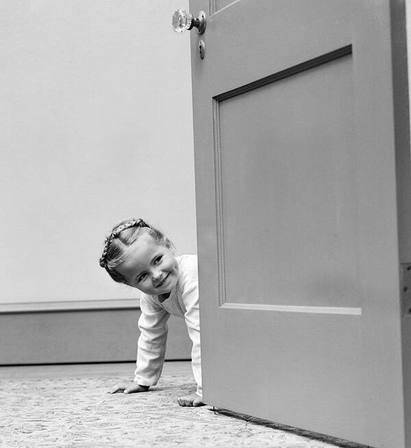 1940s Poster featuring the photograph Little Girl Peering Around Door, C.1940s by H. Armstrong Roberts/ClassicStock