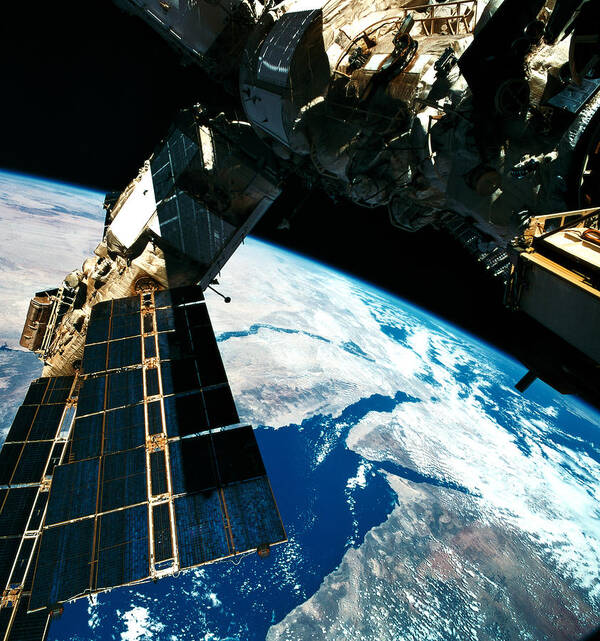 Square Poster featuring the photograph A Satellite Orbiting Above The Earth #1 by Stockbyte
