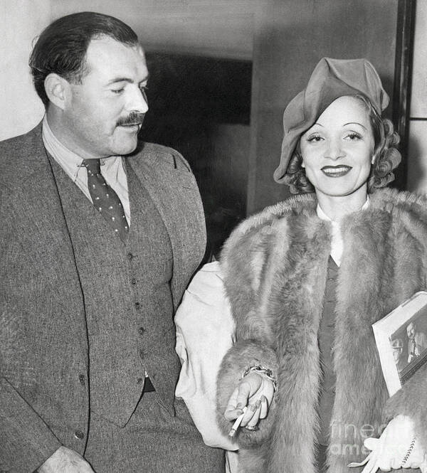 Smoking Poster featuring the photograph Ernest Hemingway And Marlene Dietrich by Bettmann