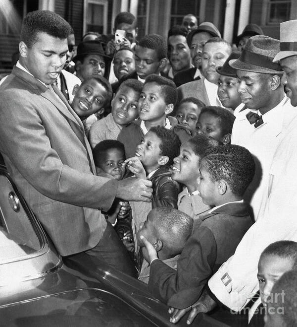Crowd Of People Poster featuring the photograph Muhammad Ali With Boys In Boston by Bettmann