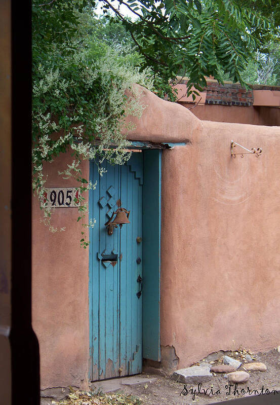 Santa Fe Poster featuring the photograph Behind the Blue Door by Sylvia Thornton