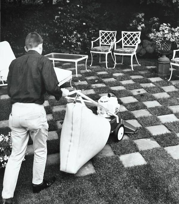 Outdoors Poster featuring the photograph Man Using Lawn Vacuum by Pedro E. Guerrero