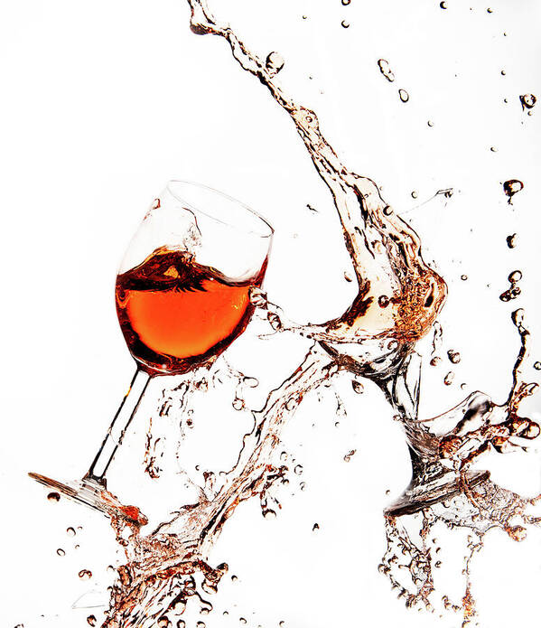 Damaged Poster featuring the photograph Broken wine glasses with wine splashes on a white background #2 by Michalakis Ppalis