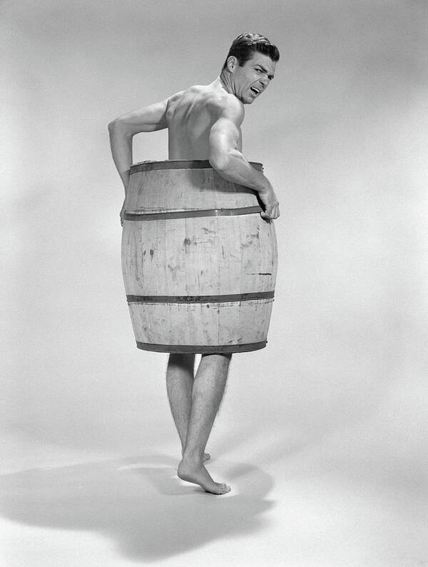 1960s-angry-naked-man-wearing-a-barrel-vintage-images.jpg