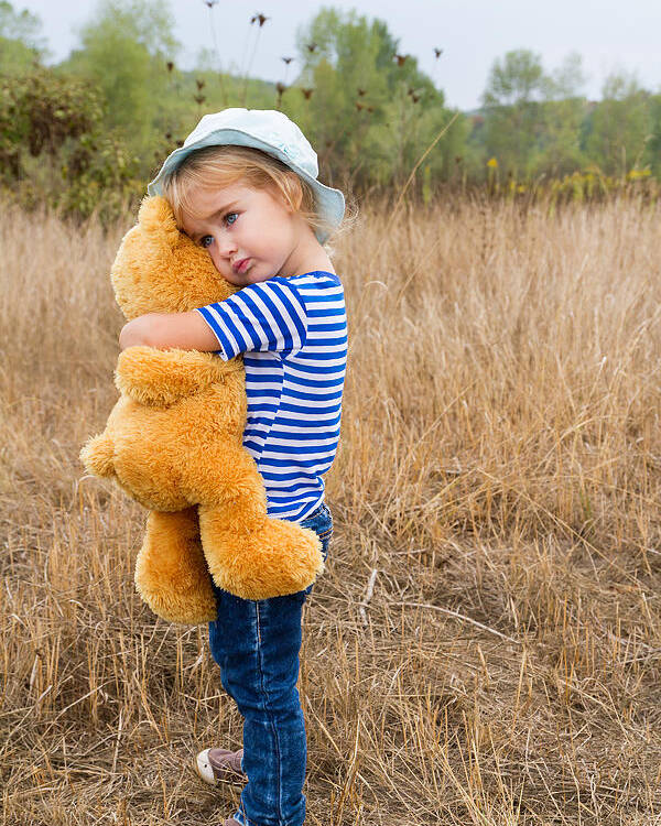 Cute little girl hugging a big Teddy bear Poster by Vyaheslav