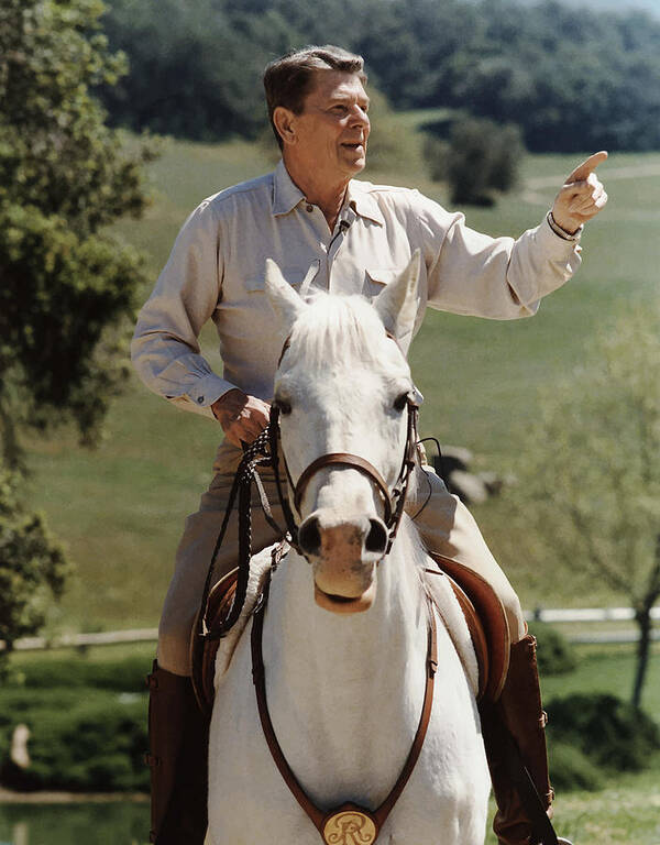 Ronald Reagan Poster featuring the photograph Ronald Reagan On Horseback by War Is Hell Store