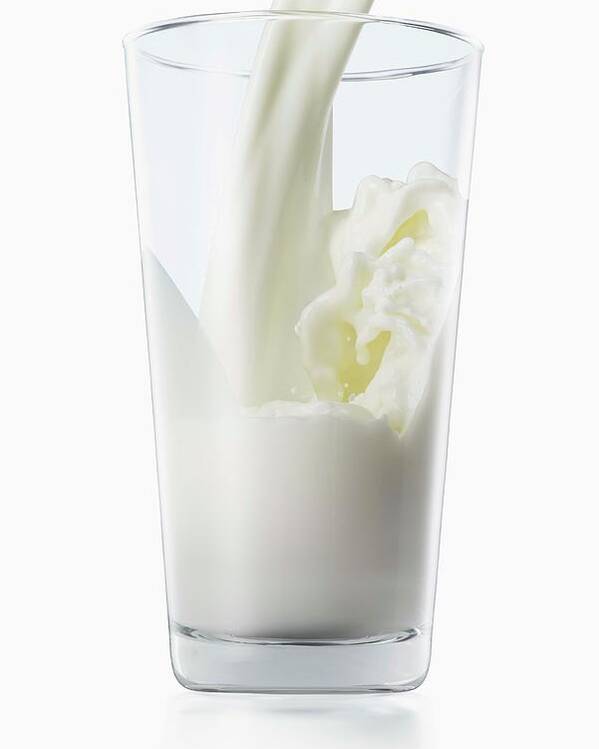Milk Pouring Into Glass Poster by Jack Andersen - Photos.com