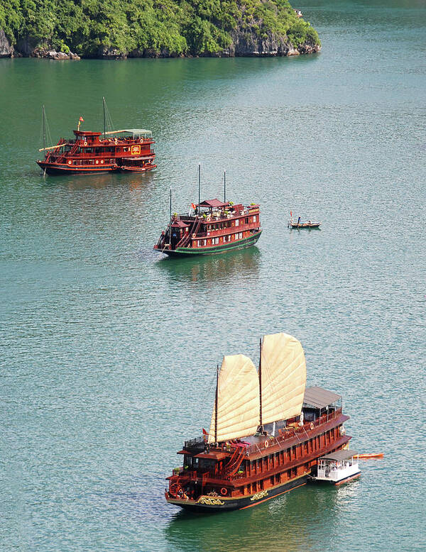 Seascape Poster featuring the photograph Tourist wooden Boats at Halong Bay Vietnam by Michalakis Ppalis