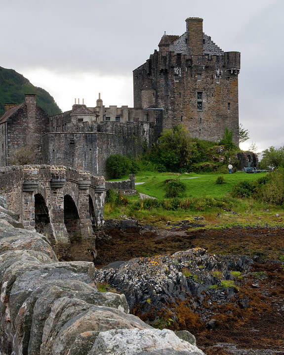 Scotland Poster featuring the photograph Eilean Donan Castle in the loch Alsh at the highlands of Scotlan by Michalakis Ppalis