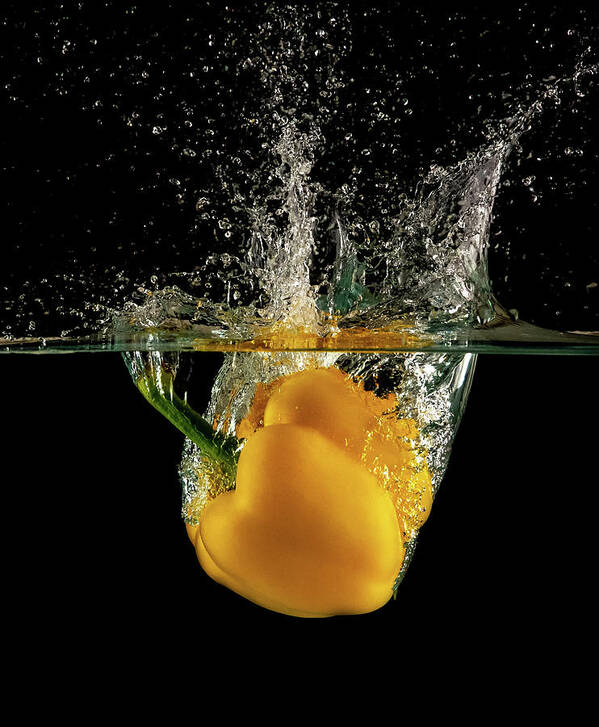 Pepper Poster featuring the photograph Yellow bell pepper dropped and slashing on water by Michalakis Ppalis