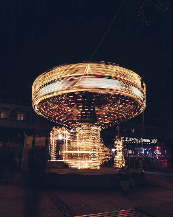 Illuminations Poster featuring the photograph Christmas carousel on the streets of Warsaw. Fire Wheel by Vaclav Sonnek