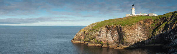 Water's Edge Poster featuring the photograph Lighthouse On Cliff Overlooking Blue by Fotovoyager