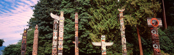 Photography Poster featuring the photograph Totem Poles In A Park, Stanley Park by Panoramic Images