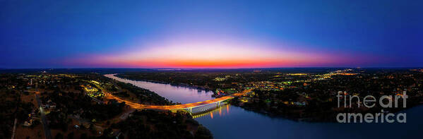 Lake Marble Falls Poster featuring the photograph A gorgeous sunset falls on the bridge over Lake Marble Falls, Texas by Dan Herron