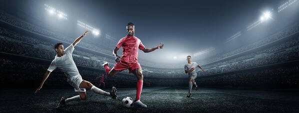 Soccer Uniform Poster featuring the photograph Soccer Player Kicking Ball In Stadium #1 by Dmytro Aksonov