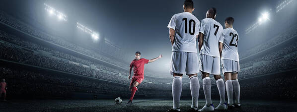 Soccer Uniform Poster featuring the photograph Soccer Player Kicking Ball In Stadium #5 by Dmytro Aksonov